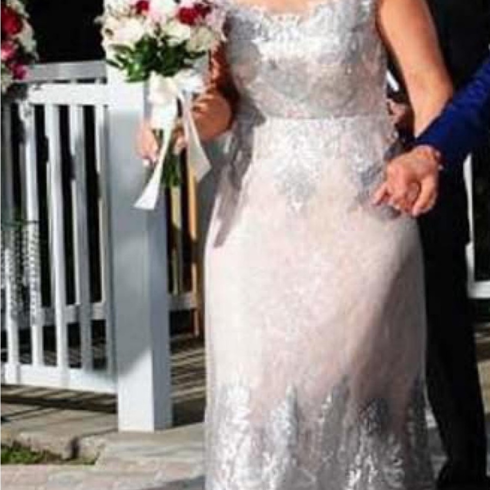 Terani Couture Ivory Lace Bridal Gown size 12 and strechy, underneath.